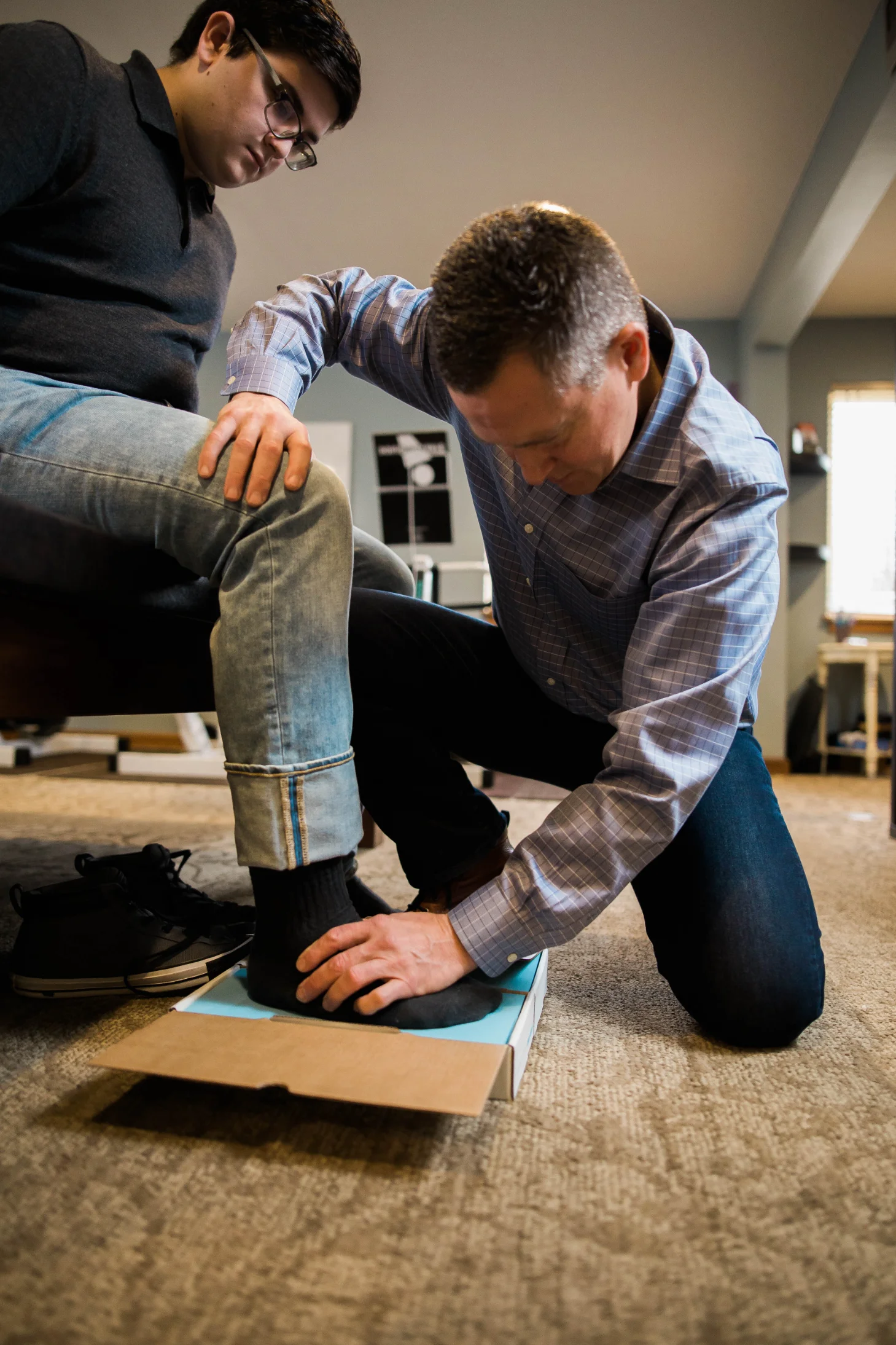 Patient receiving custom orthotics at a chiropractic clinic in Marysville, Ohio