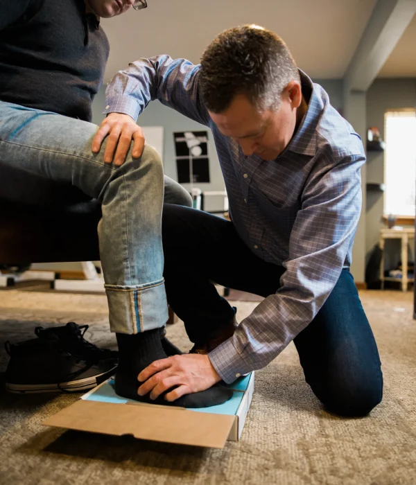 Patient receiving custom orthotics at a chiropractic clinic in Marysville, Ohio