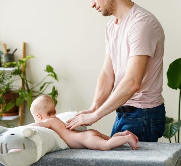 adult-father-gives-his-little-baby-son-massage-at-2026-01-07-00-25-50-utc